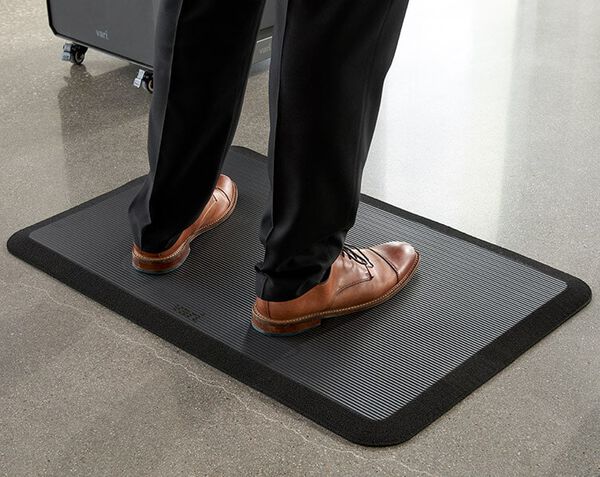 professional stands on mat and exhibits the support offered by it